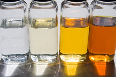 Bottles of Oil in Sunlight | Saint-Gobain Tape Solutions