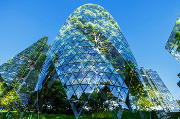 Digital composite of trees and office buildings a downtown city district