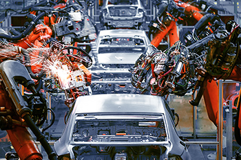 An assembly line of robotic arms producing automobiles
