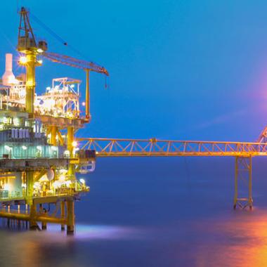 Oil and gas platform in the gulf or the sea.