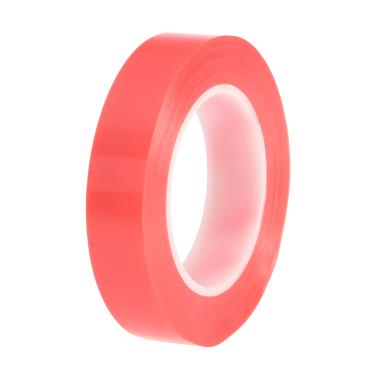 A spool of red adhesive tape.