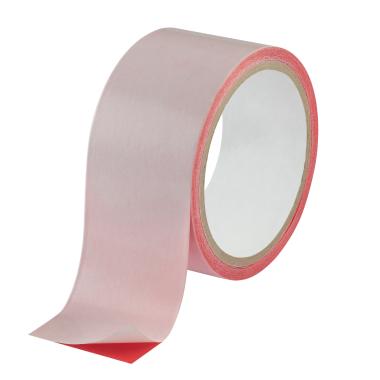 A wide spool of red adhesive tape with opaque liner.