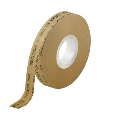 A thin spool of brown adhesive tape with printed text on liner.