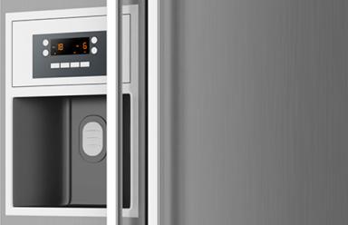 Modern appliances featuring a freezer and refrigerator.