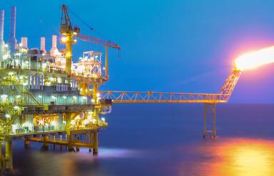 Oil and gas platform in the gulf or the sea.