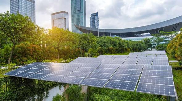  Solar panels above green areas in urban environment.
