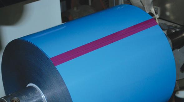 Blue splicing roll of adhesive.
