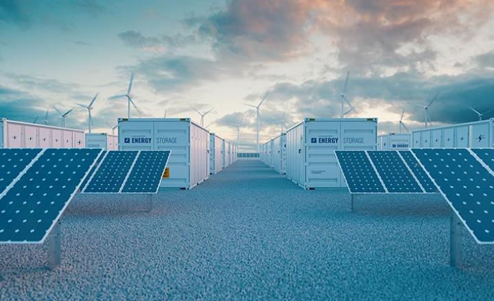 Battery storage power station accompanied by solar and wind turbine power plants.