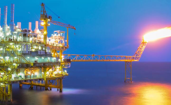 Oil and gas platform in the gulf or the sea.