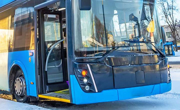 High-voltage electric charging station for a city bus with an open door.