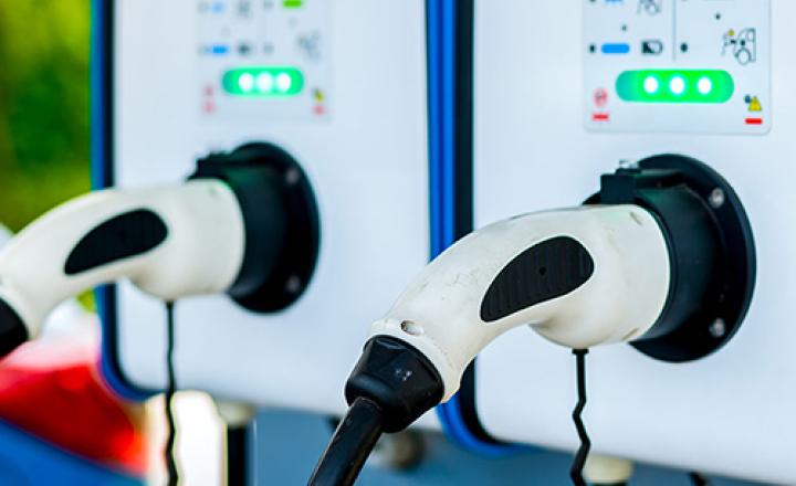 Electric car charging station, with two plugs, for charging the EV battery of a hybrid vehicle.