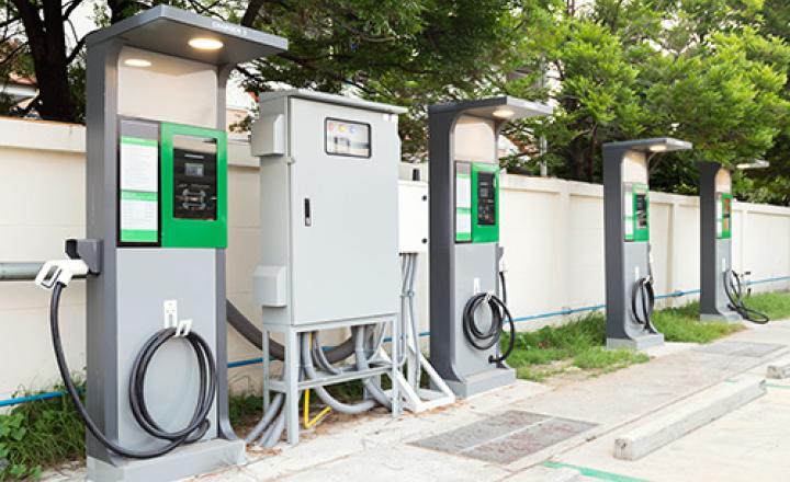 Electric vehicle car chargers with cable plug supplies at EV station sites.