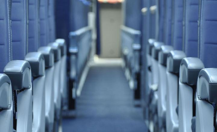 Commercial aircraft interior aisle with carpet flooring