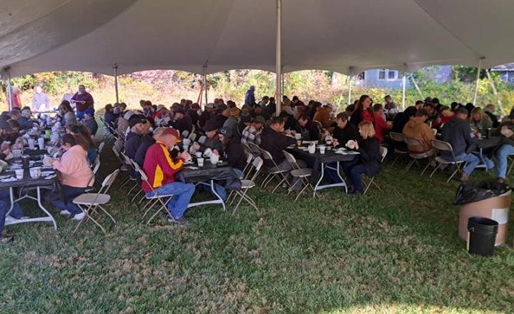 HicksStrong Hug Mugs group painting under tent
