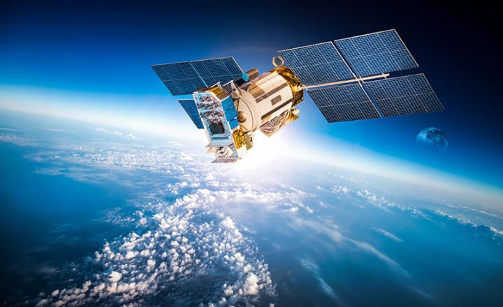 Satellite in Space with Earth in the Background