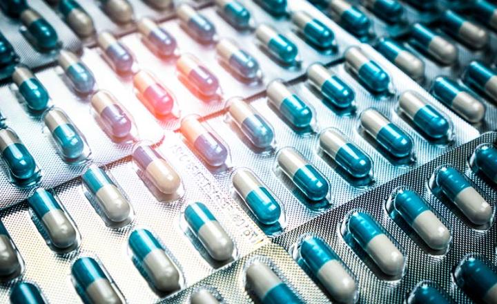 Blue and white medical pills in their packaging