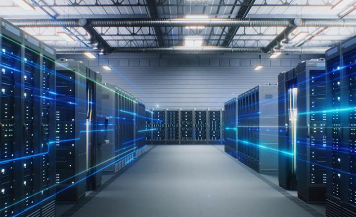 A data center with multiple server racks in a futuristic warehouse.