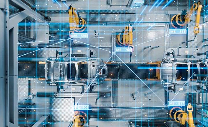 Aerial view of electric vehicle assembly line in a manufacturing factory.