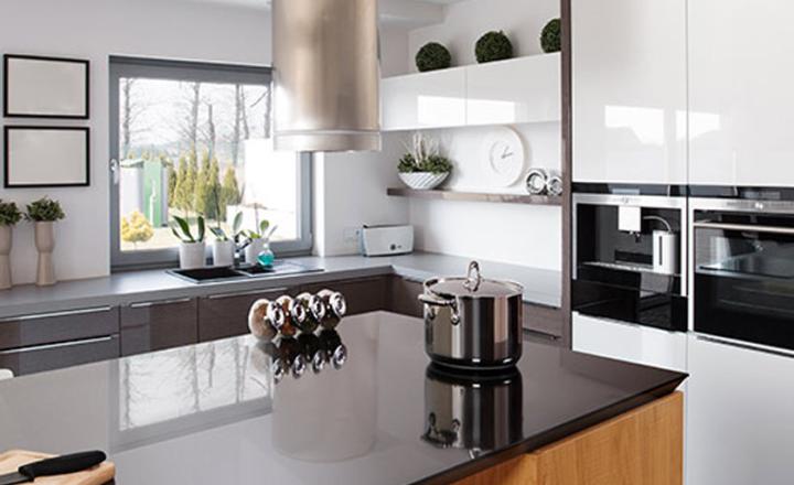 Clean, modern luxury kitchen interior with contemporary ovens, countertops and décor.