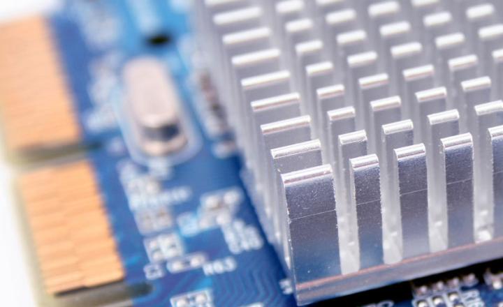 PC hardware heat sink detail with electronic microchip circuitry.