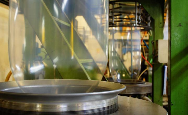 A transparent, vertically blown film extrusion during heat-sealing process.