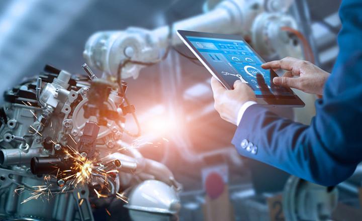 Manager engineer check and control automation robot arms machine in intelligent factory industrial on real time monitoring system software.