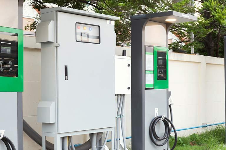 Electric vehicle car chargers with cable plug supplies at EV station sites.