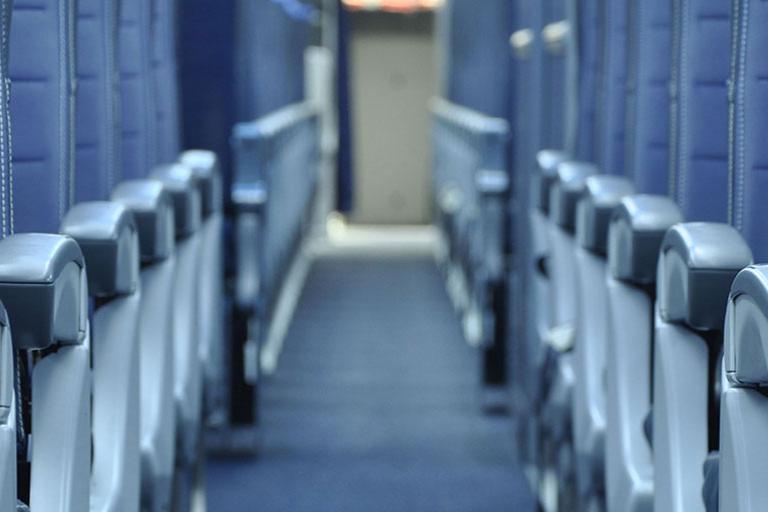 Commercial aircraft interior aisle with carpet flooring