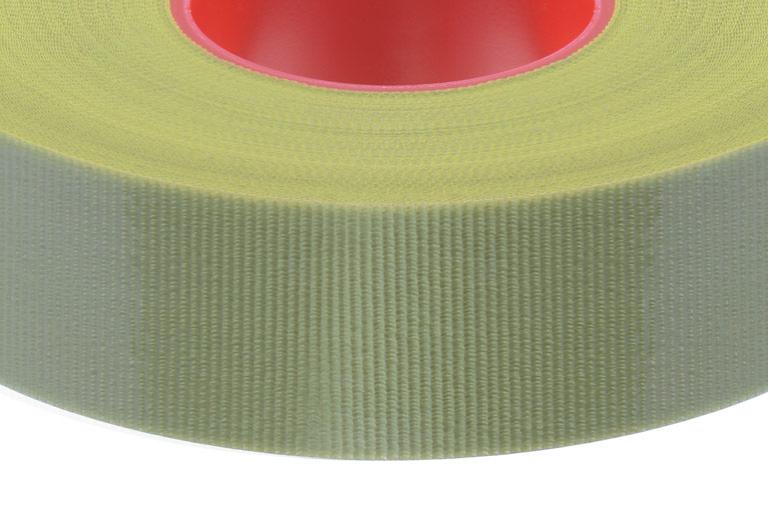 A green colored tape roll with red inner liner.