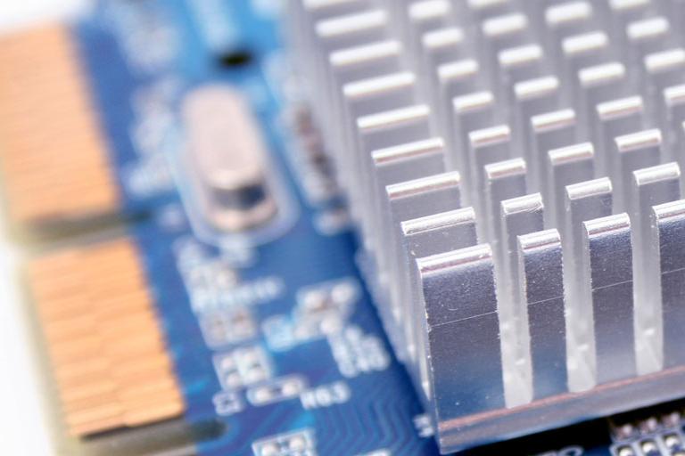 PC hardware heat sink detail with electronic microchip circuitry.