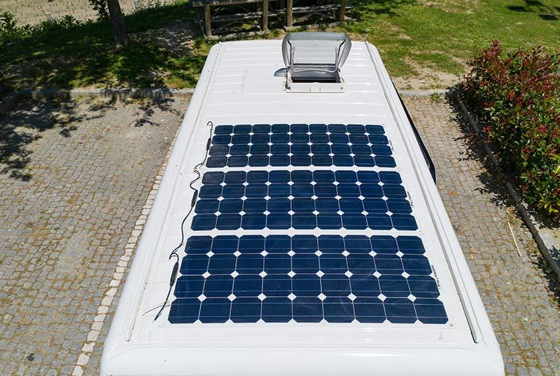 Camper van Solar roof panels with skylight on top of a camper van motorhome.