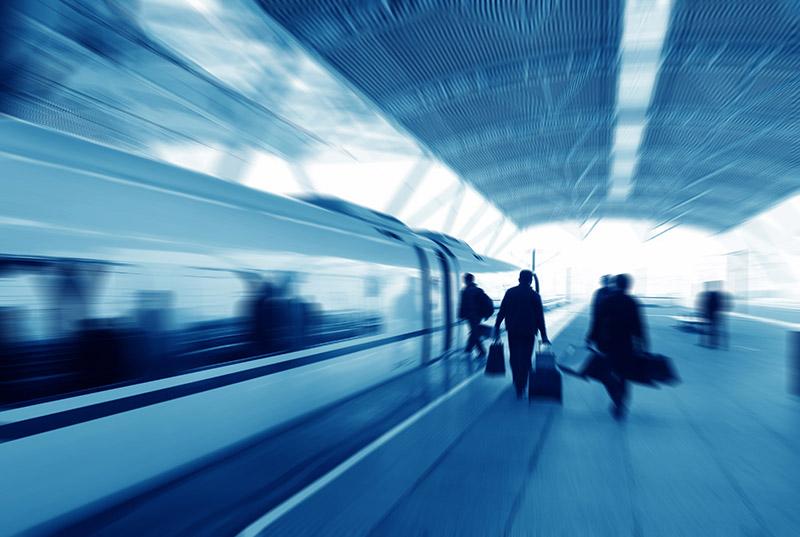 Travelers boarding a modern high-speed train in station