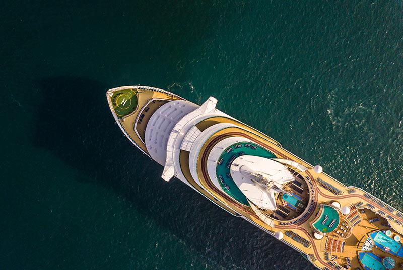 Cruise ship with aerial view of front bow on open sea.