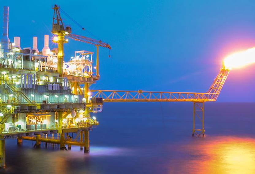 Oil and gas platform in the gulf or the sea.